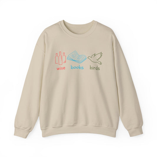 Beige sweatshirt with 'wine', 'books', and 'birds' text and graphics on a white background