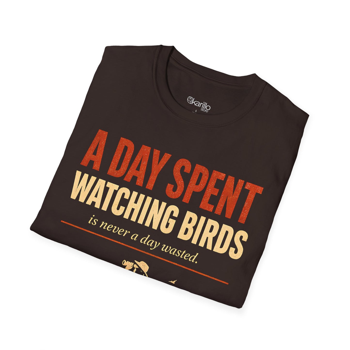 Folded brown color t-shirt with text "a day spent watching birds" and birdwatcher person graphic with white background.