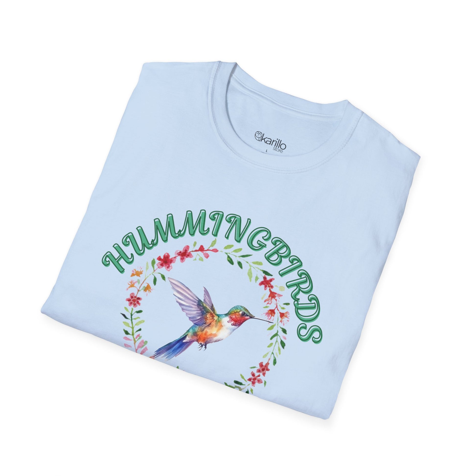 Folded view light blue t-shirt with hummingbird design and text on a white background