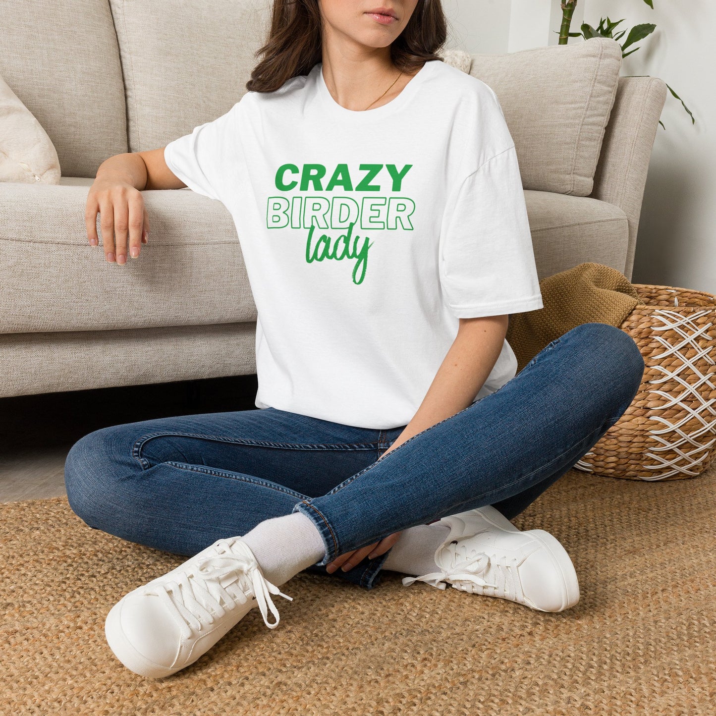 Person wearing white t-shirt with "crazy birder girl" text on a white background