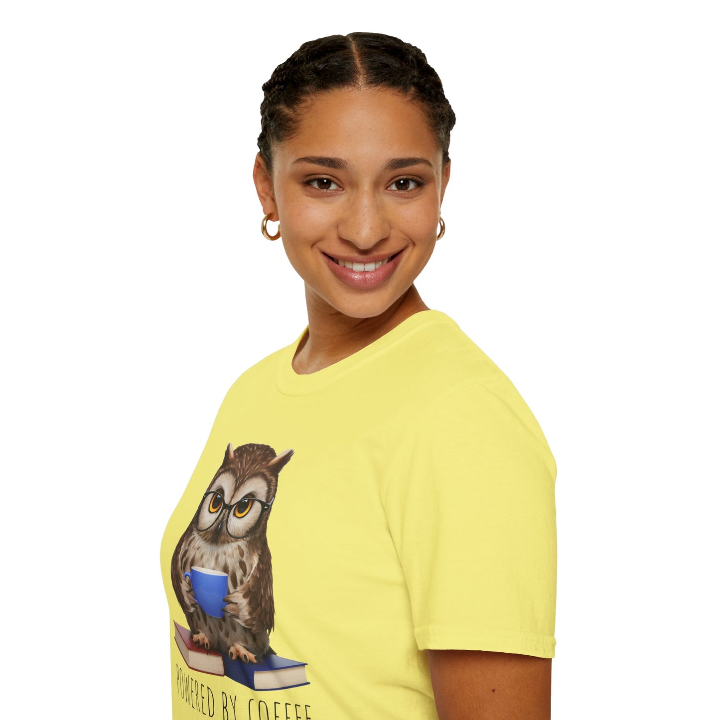 Person wearing a yellow t-shirt with an owl graphic and text on a white background