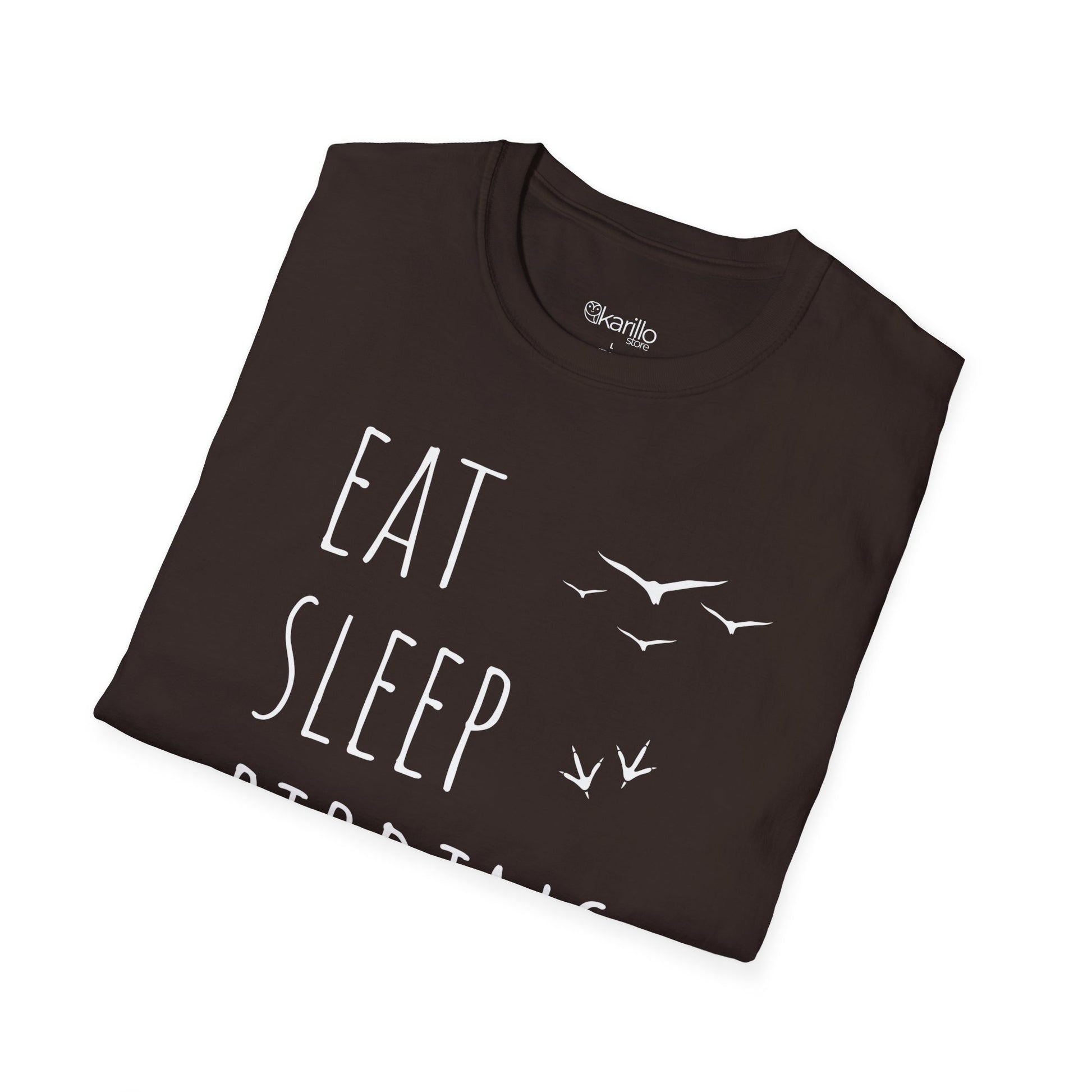Folded brown t-shirt with 'Eat Sleep Birding' text and bird illustrations on a white background