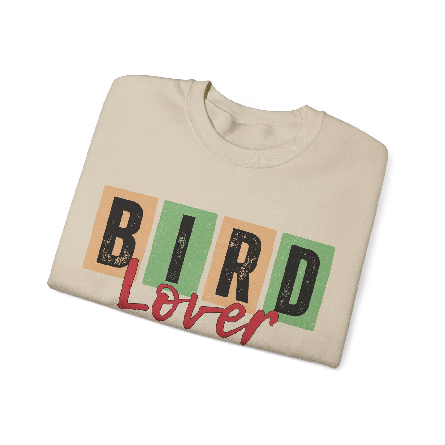 Folded beige sweatshirt with 'Bird Lover' text on a white background