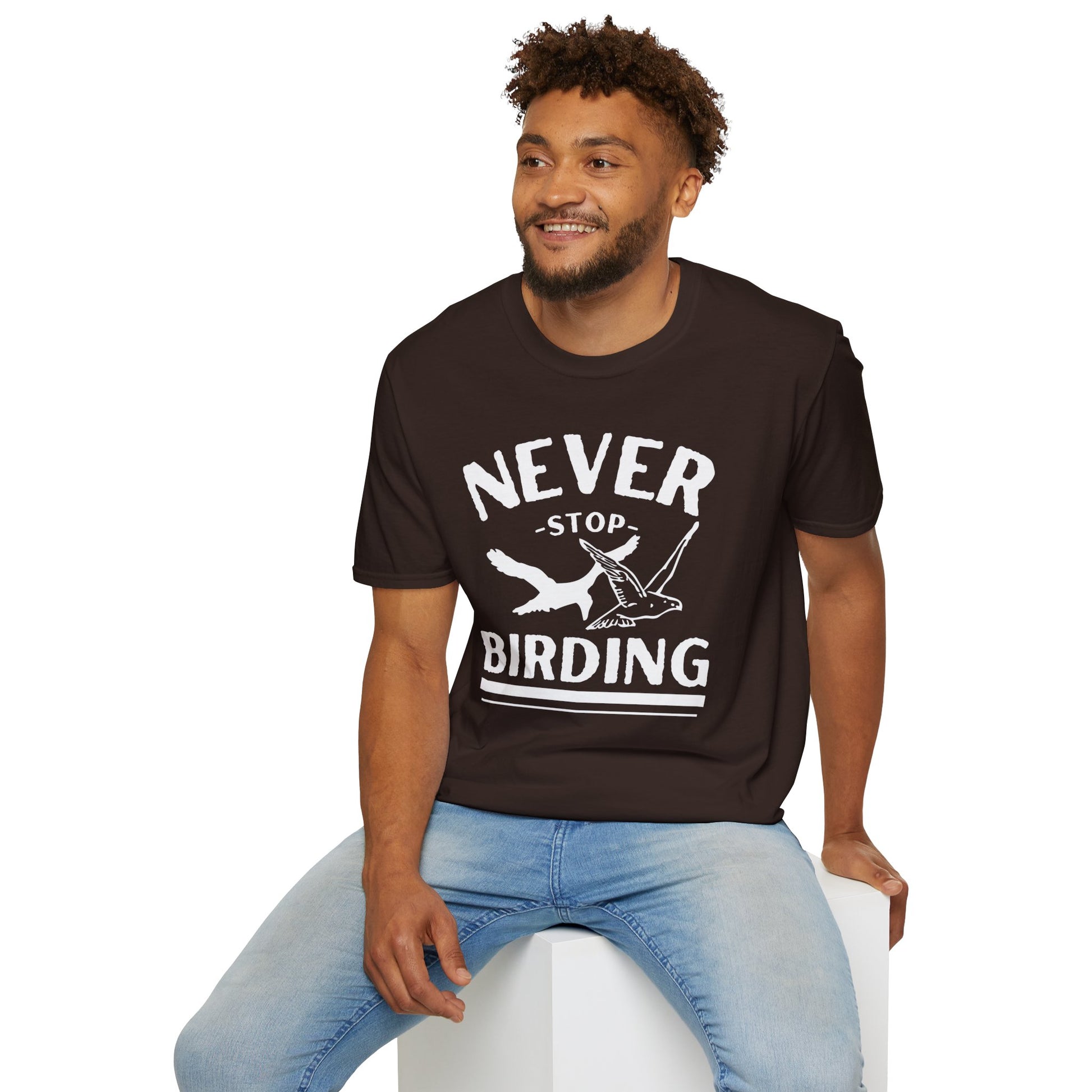 man wearing Brown t-shirt with 'Never Stop Birding' text and bird graphics on a white background