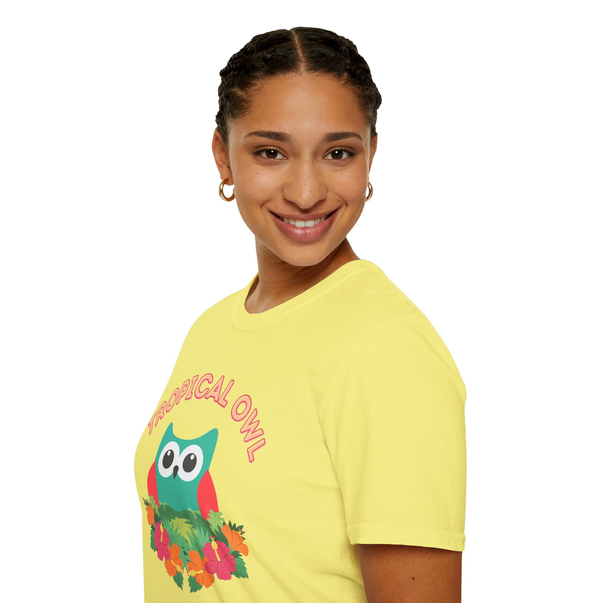 Person wearing a yellow t-shirt with a colorful owl graphic and text on a white background