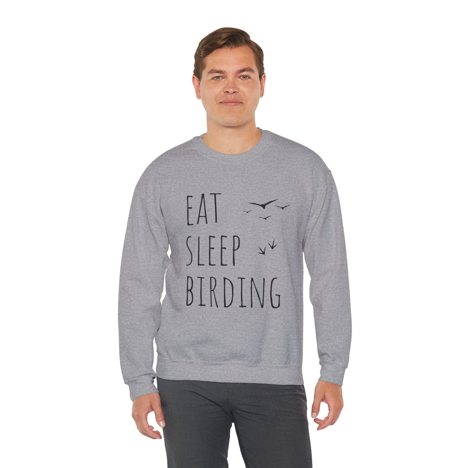 Man wearing a gray sweatshirt with 'Eat Sleep Birding' text on a white background
