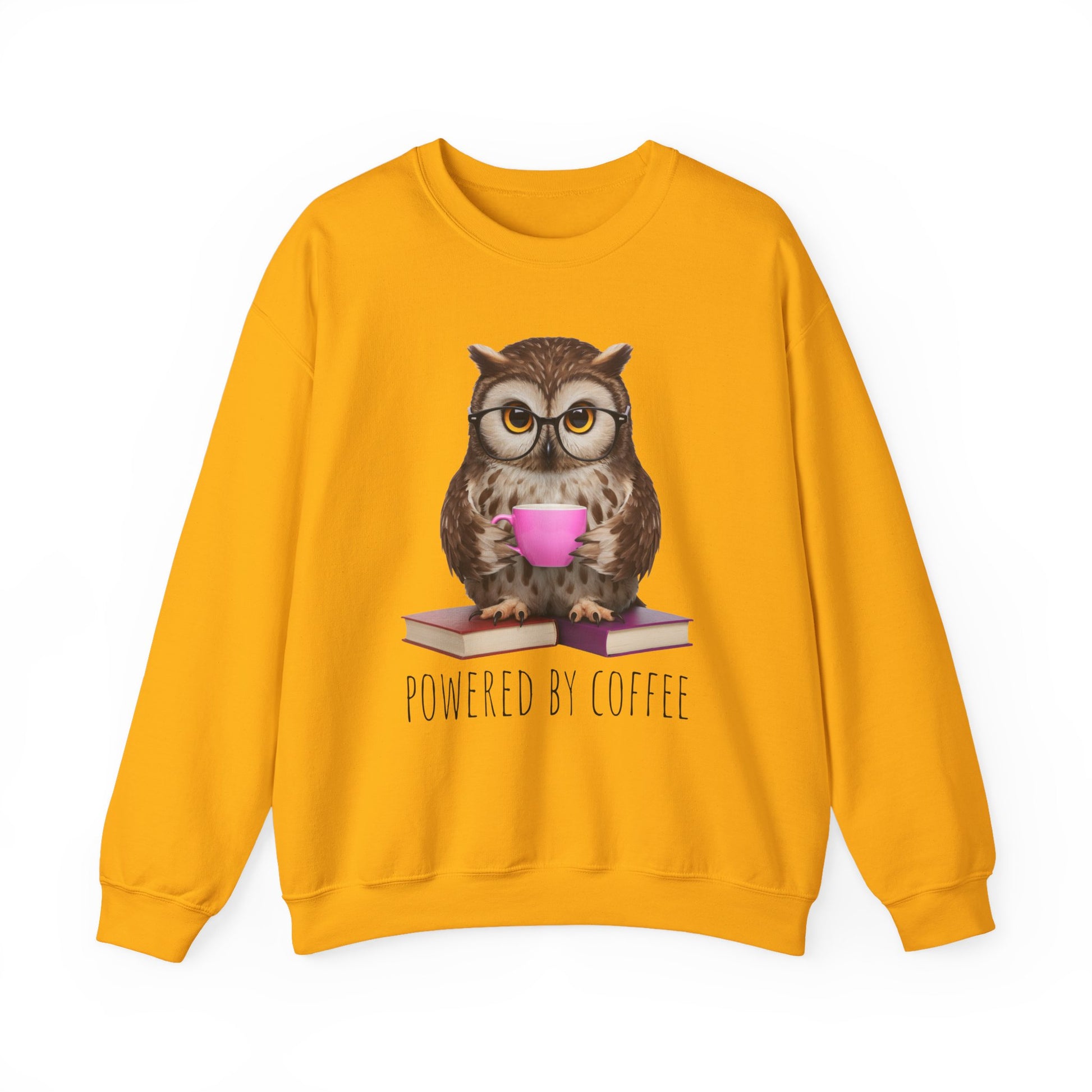 Yellow sweatshirt with an owl graphic holding a coffee cup and books, text 'Powered by Coffee' on a white background.