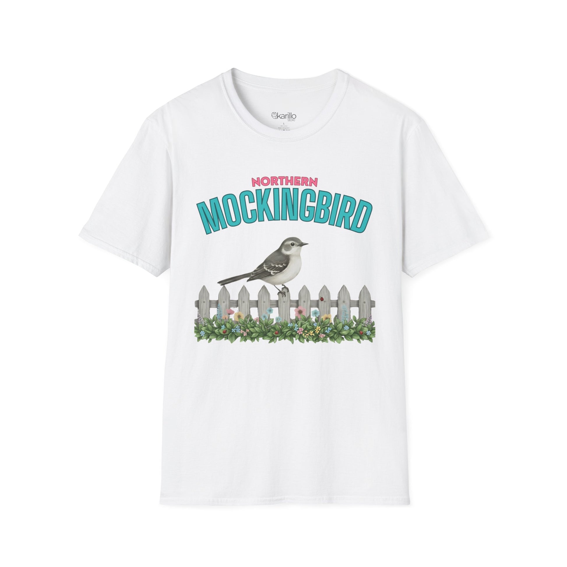 A white t-shirt with a graphic print featuring the text 'NORTHERN MOCKINGBIRD' in teal and pink, an illustration of a mockingbird perched on a white picket fence with green foliage, with white background.