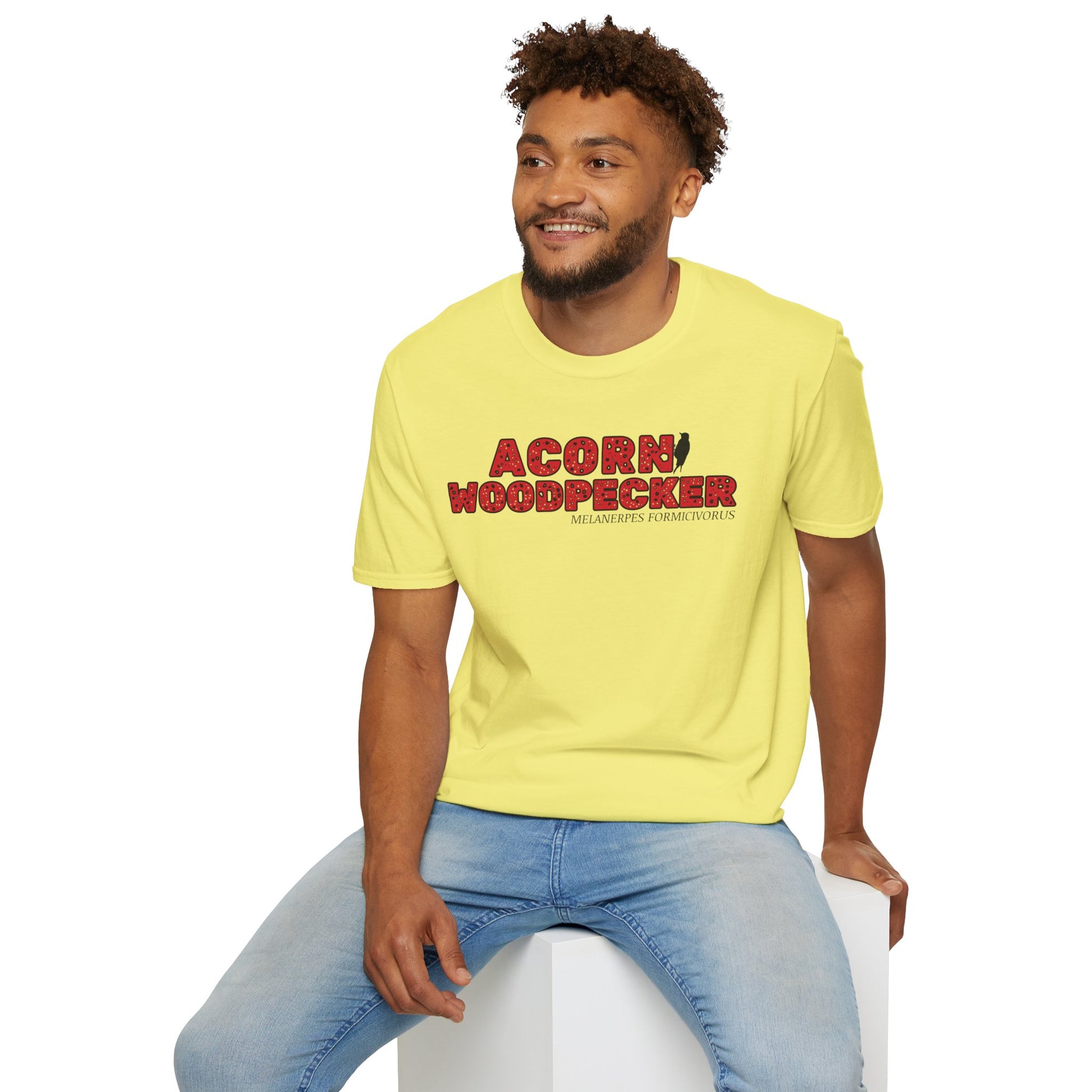 Man wearing yellow t-shirt with "acorn woodpecker bird" text on a white background