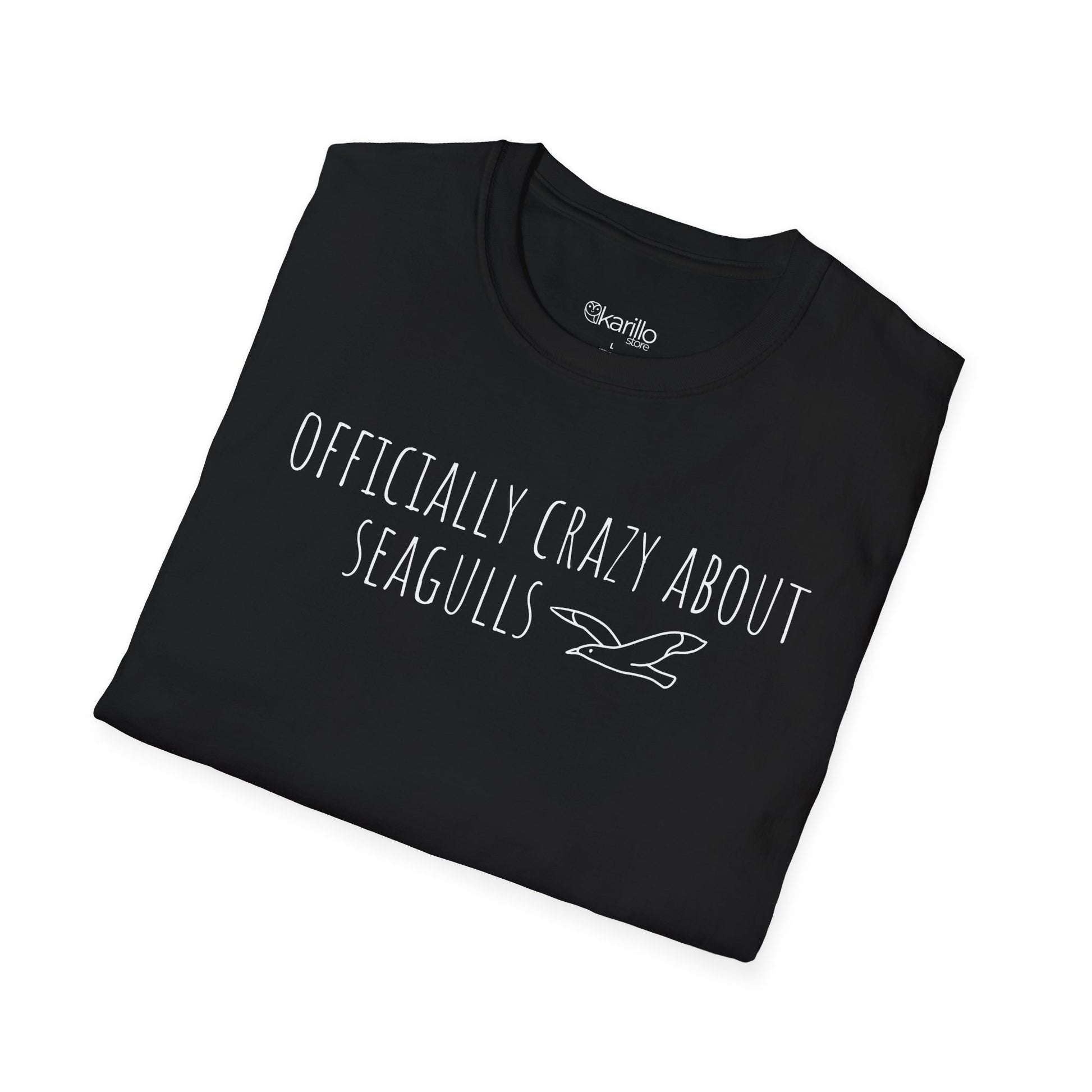 Folded Black t-shirt with text 'Officially crazy about seagulls' on a white background
