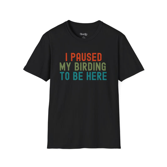 Front view of Black t-shirt with colorful text 'I PAUSED MY BIRDING TO BE HERE' on a white background