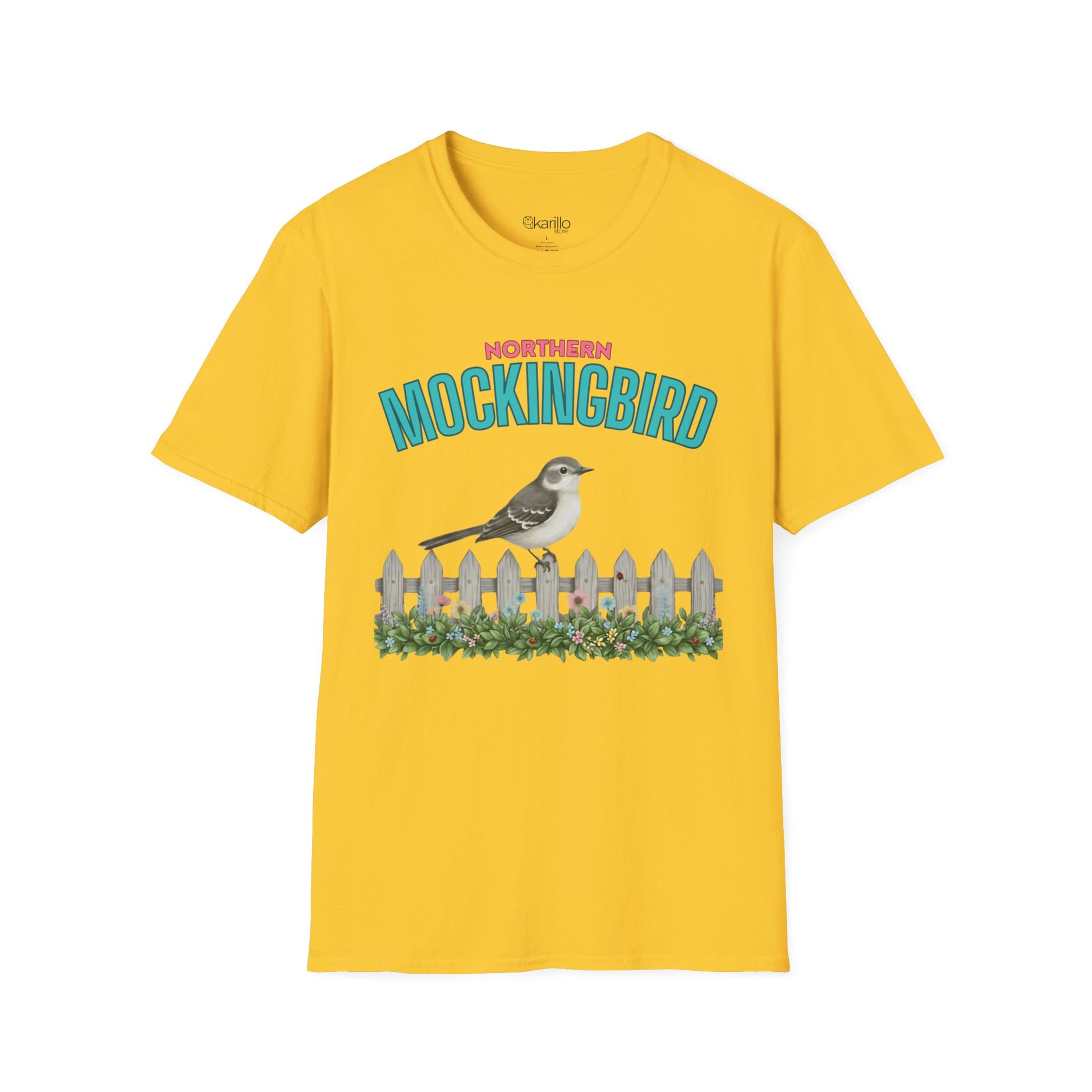 A yellow t-shirt with a graphic print featuring the text 'NORTHERN MOCKINGBIRD' in teal and pink, an illustration of a mockingbird perched on a white picket fence with green foliage, with white background.