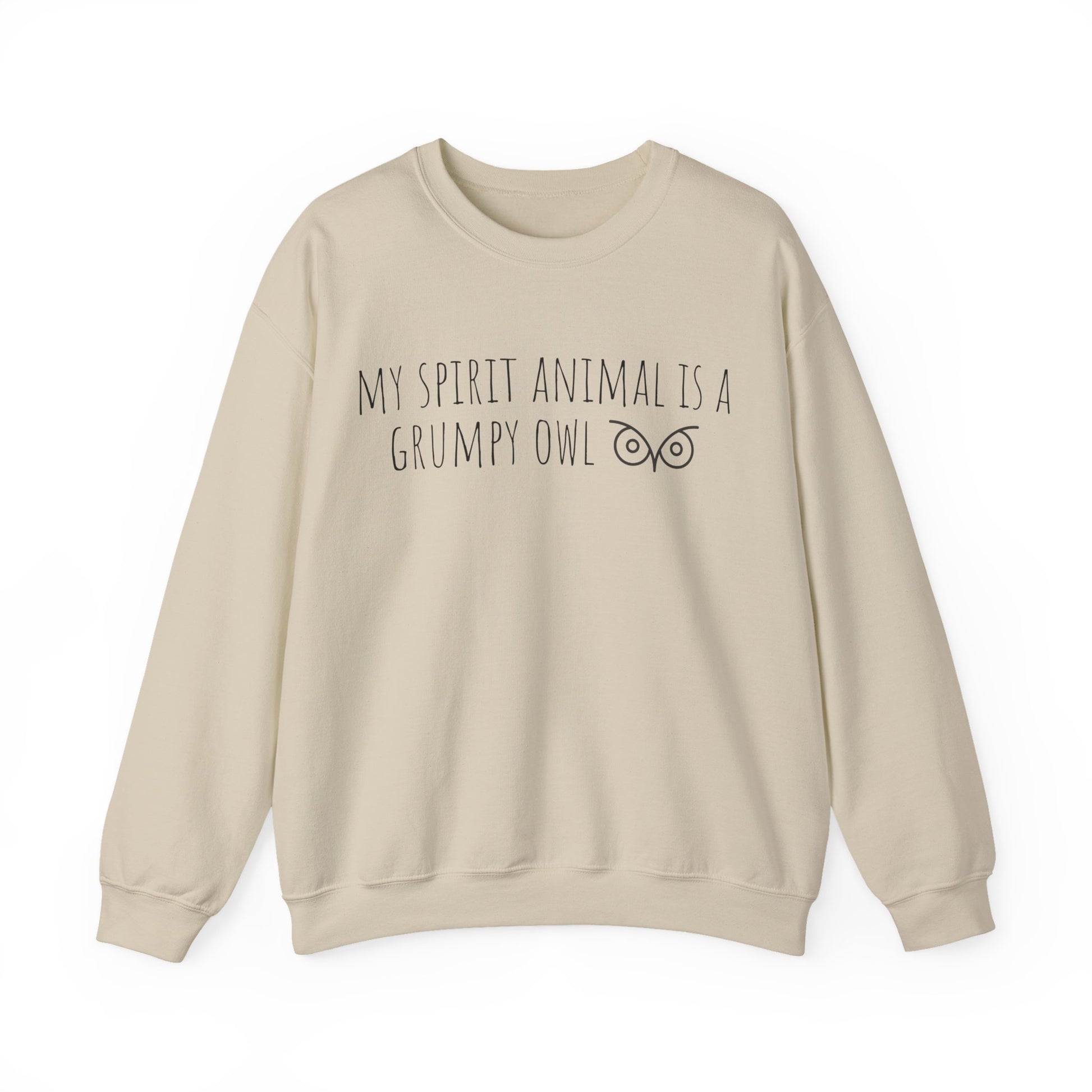 Beige sweatshirt with text 'My spirit animal is a grumpy owl' on a white background