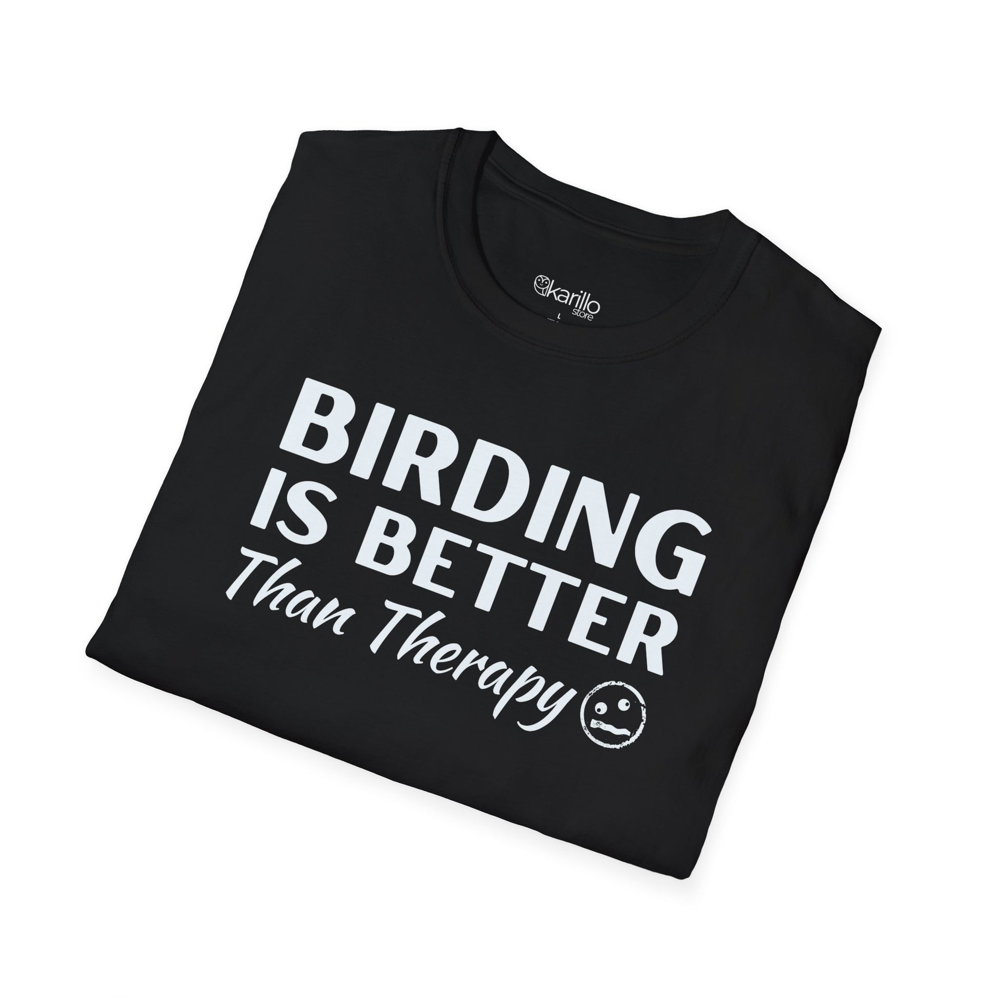 Folded black t-shirt with 'Birding is Better Than Therapy' text on a white background