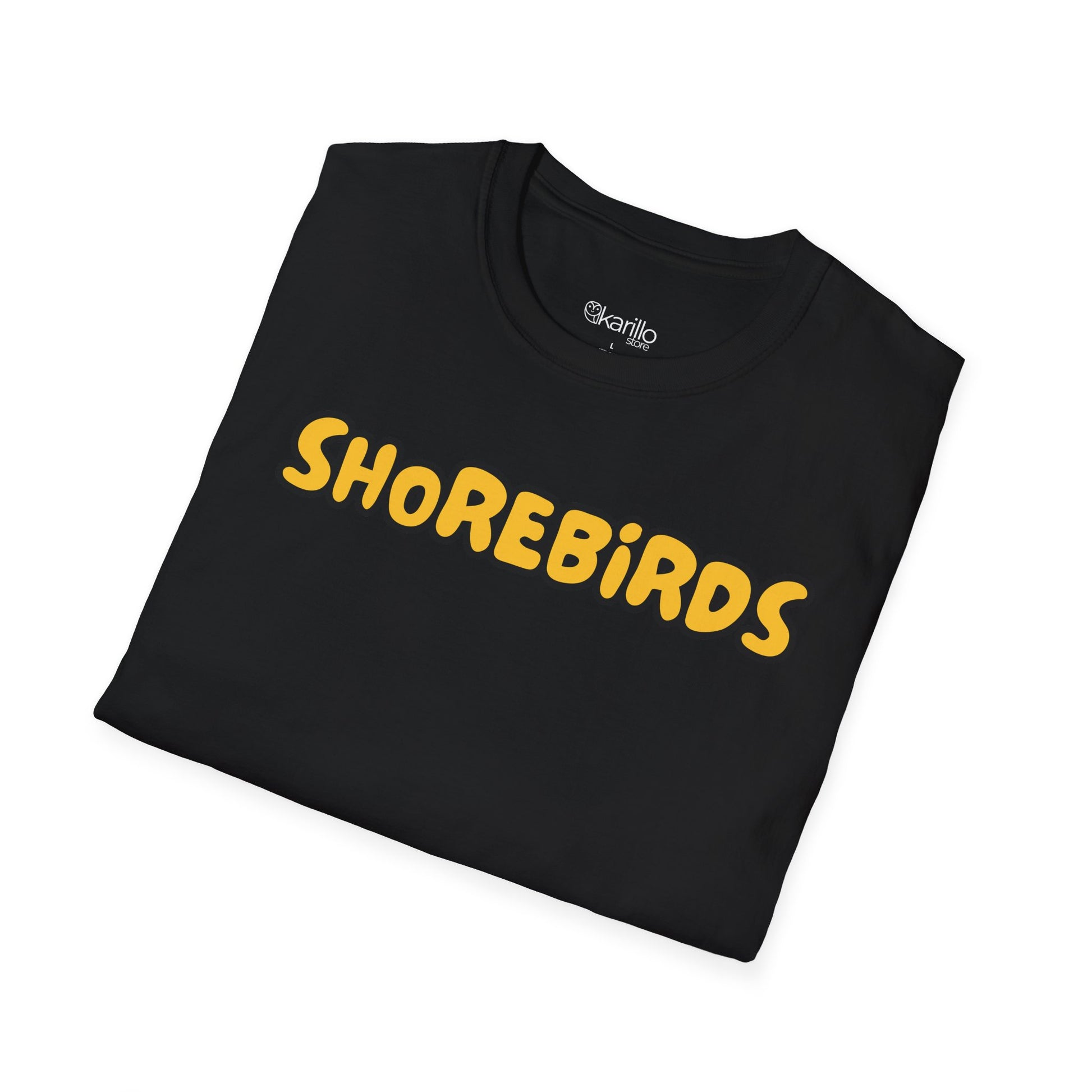 Folded black t-shirt with 'SHOREBiRDS' in yellow on a white background