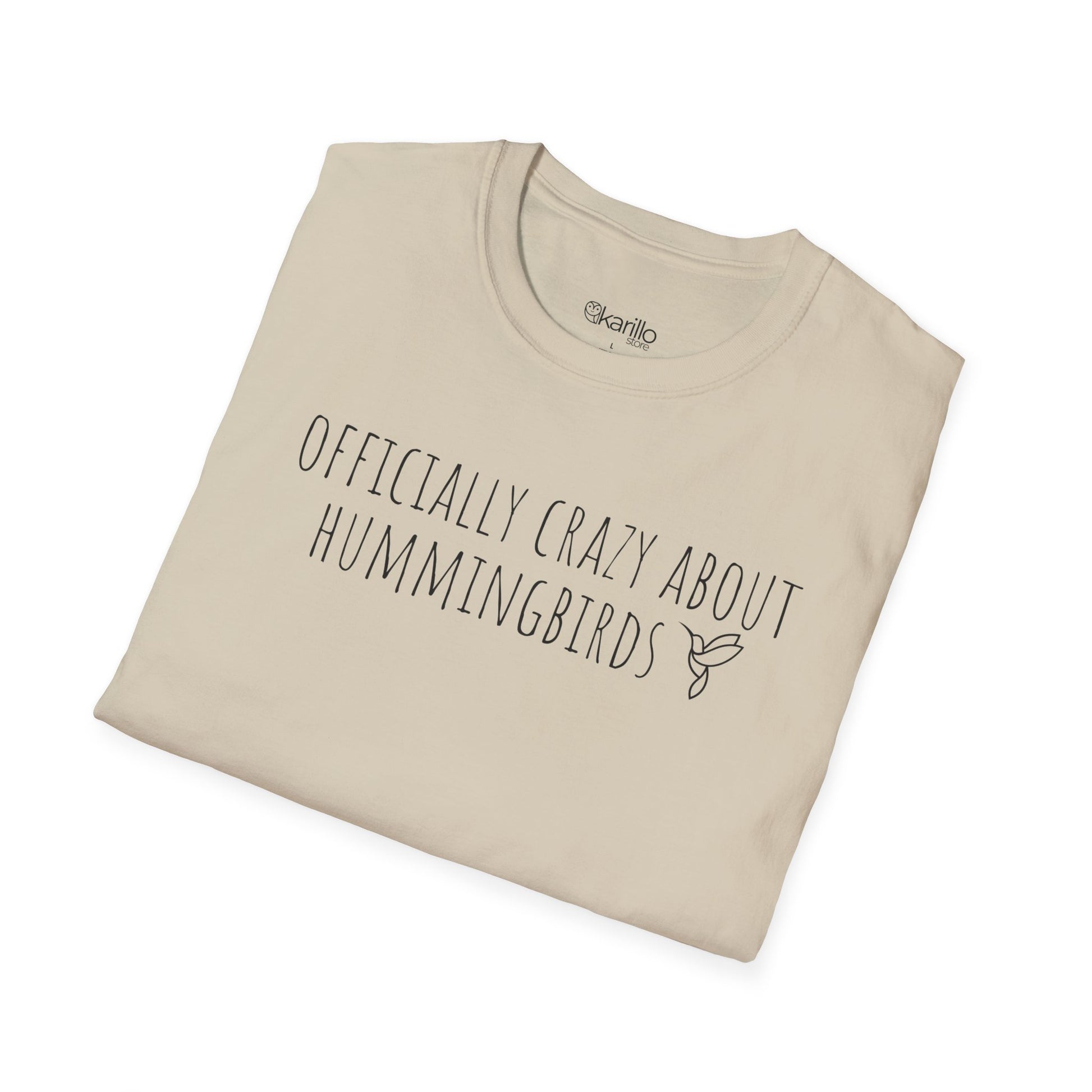folded sand t-shirt with text 'Officially crazy about hummingbirds' on a white background