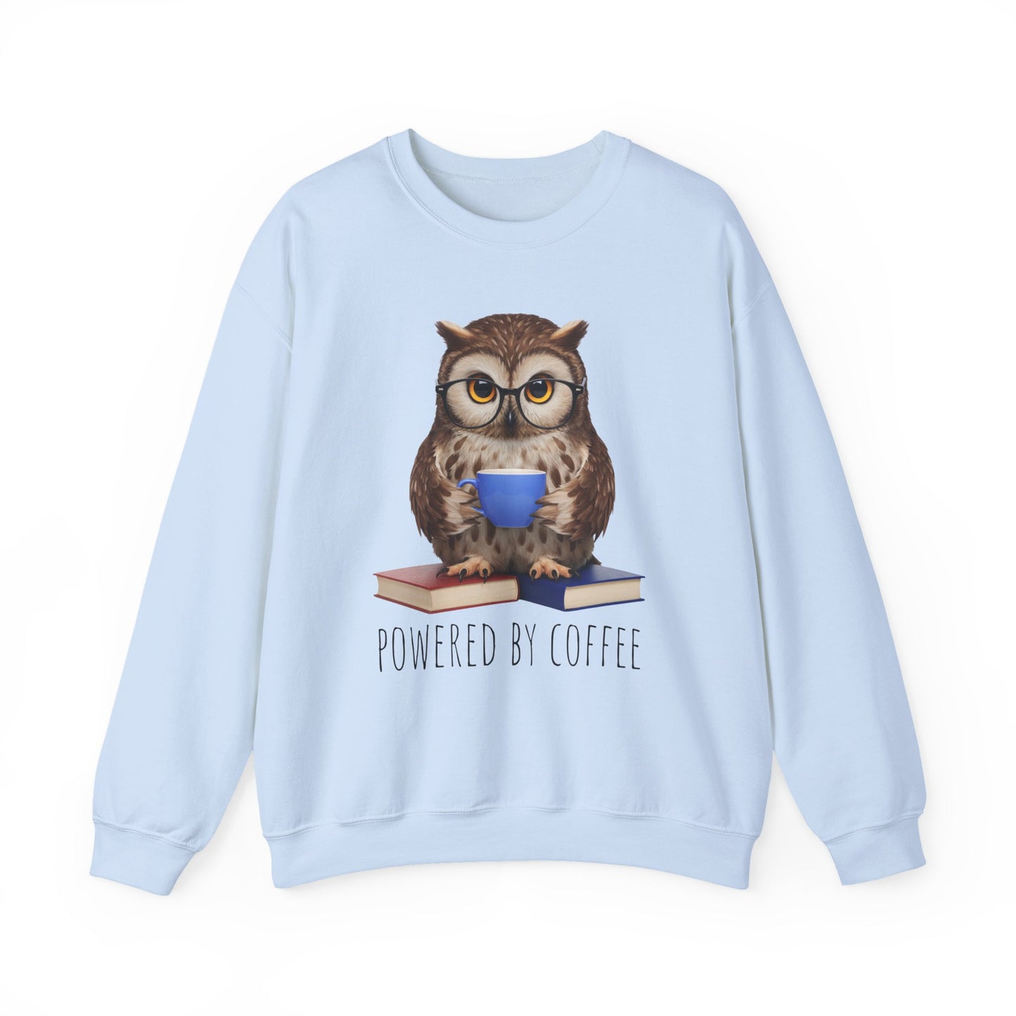 Light blue sweatshirt with an owl graphic holding a coffee cup and books, text 'Powered by Coffee' on a white background.