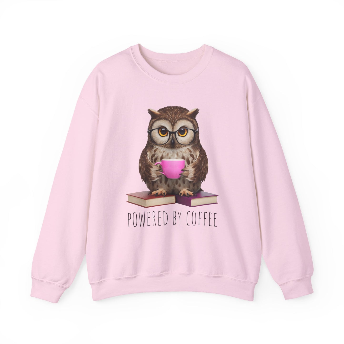 Pink sweatshirt with an owl holding a coffee cup and books, labeled 'Powered by Coffee', on a white background.