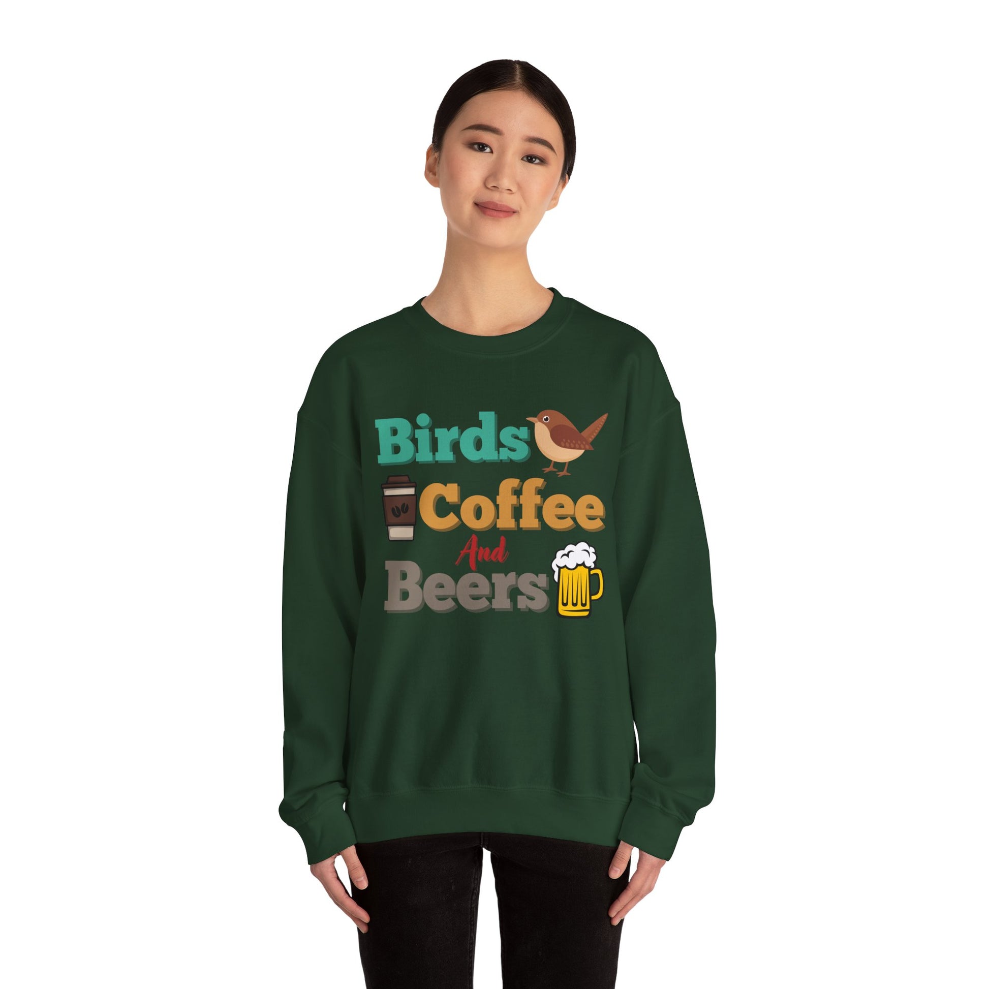 Person wearing green sweatshirt with colorful "bird, coffee, beers" text and graphics on a white background