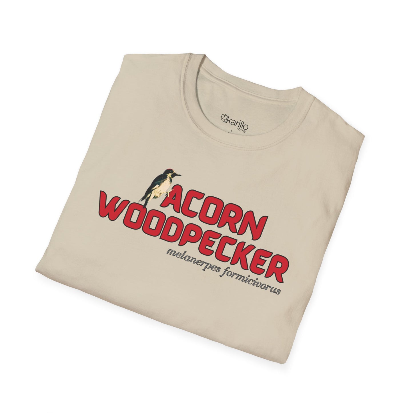 Folded view sand color t-shirt with 'acorn woodpecker' text on a white background
