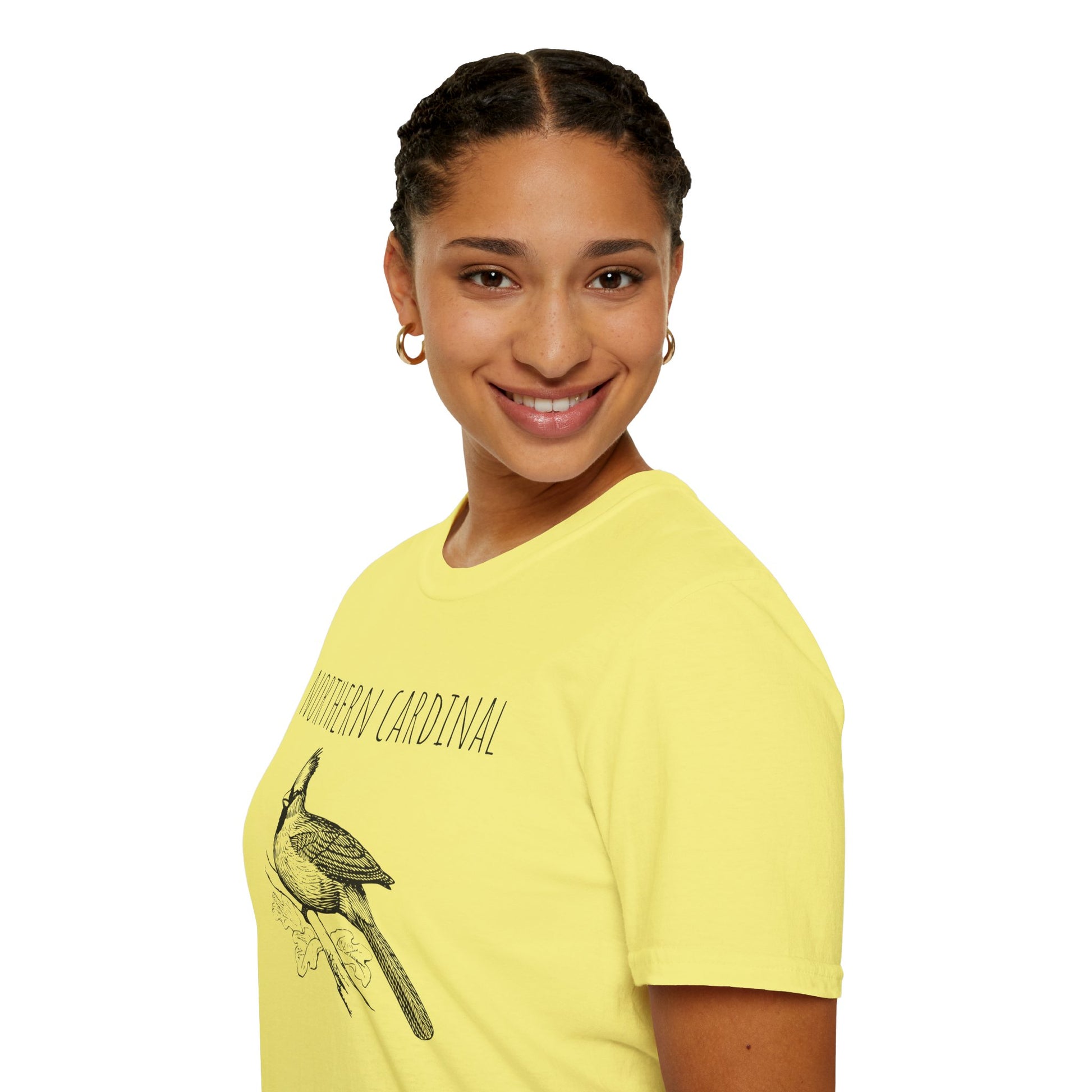 Person wearing a yellow t-shirt with a bird graphic and text on a white background