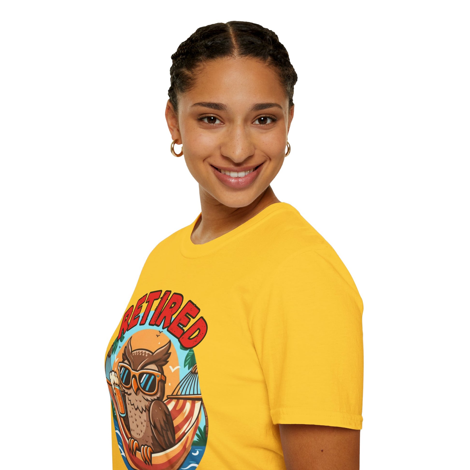 Person wearing a yellow t-shirt with a graphic design of an owl and text on a white background