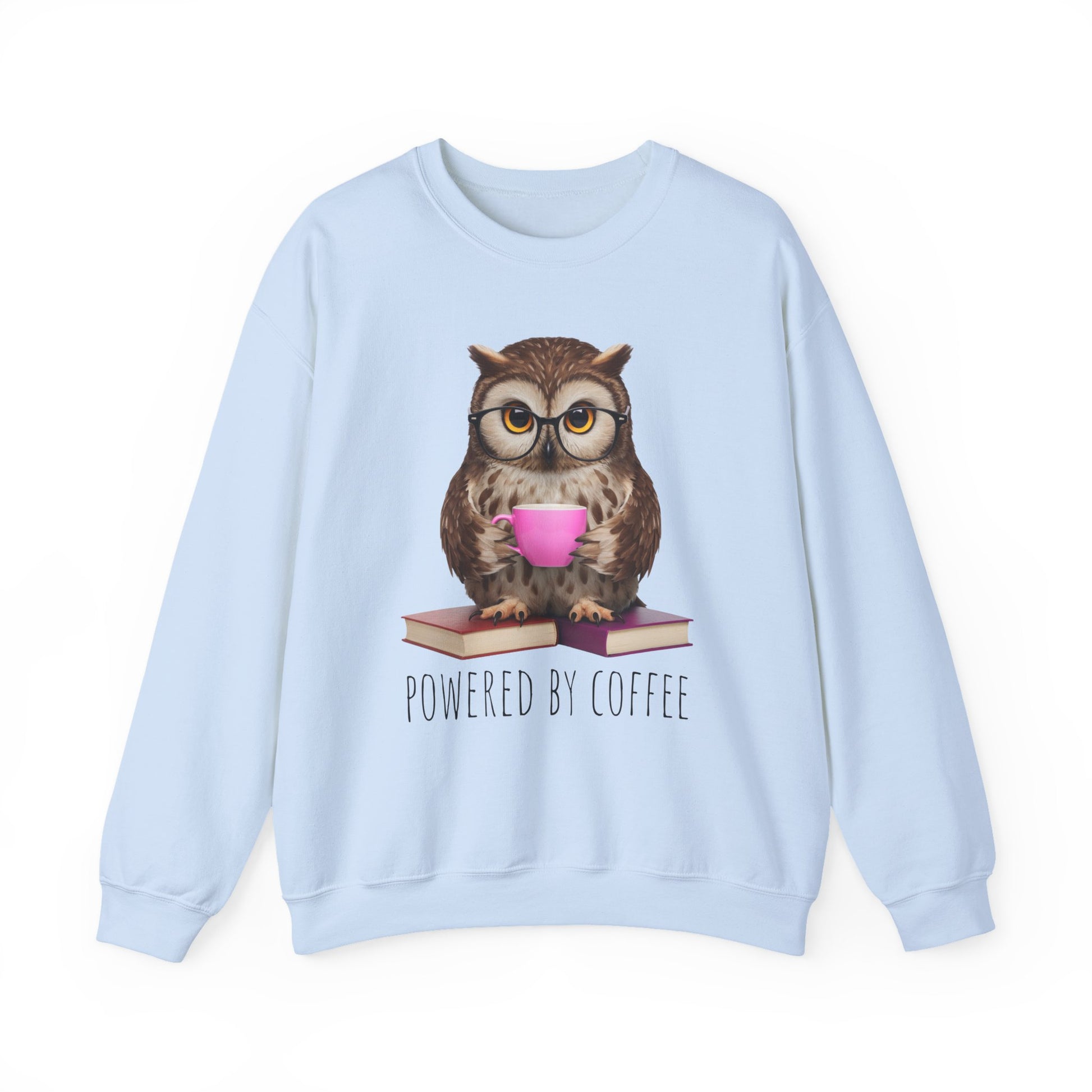 Light blue sweatshirt with an owl holding a pink cup and 'Powered by Coffee' text on a white background