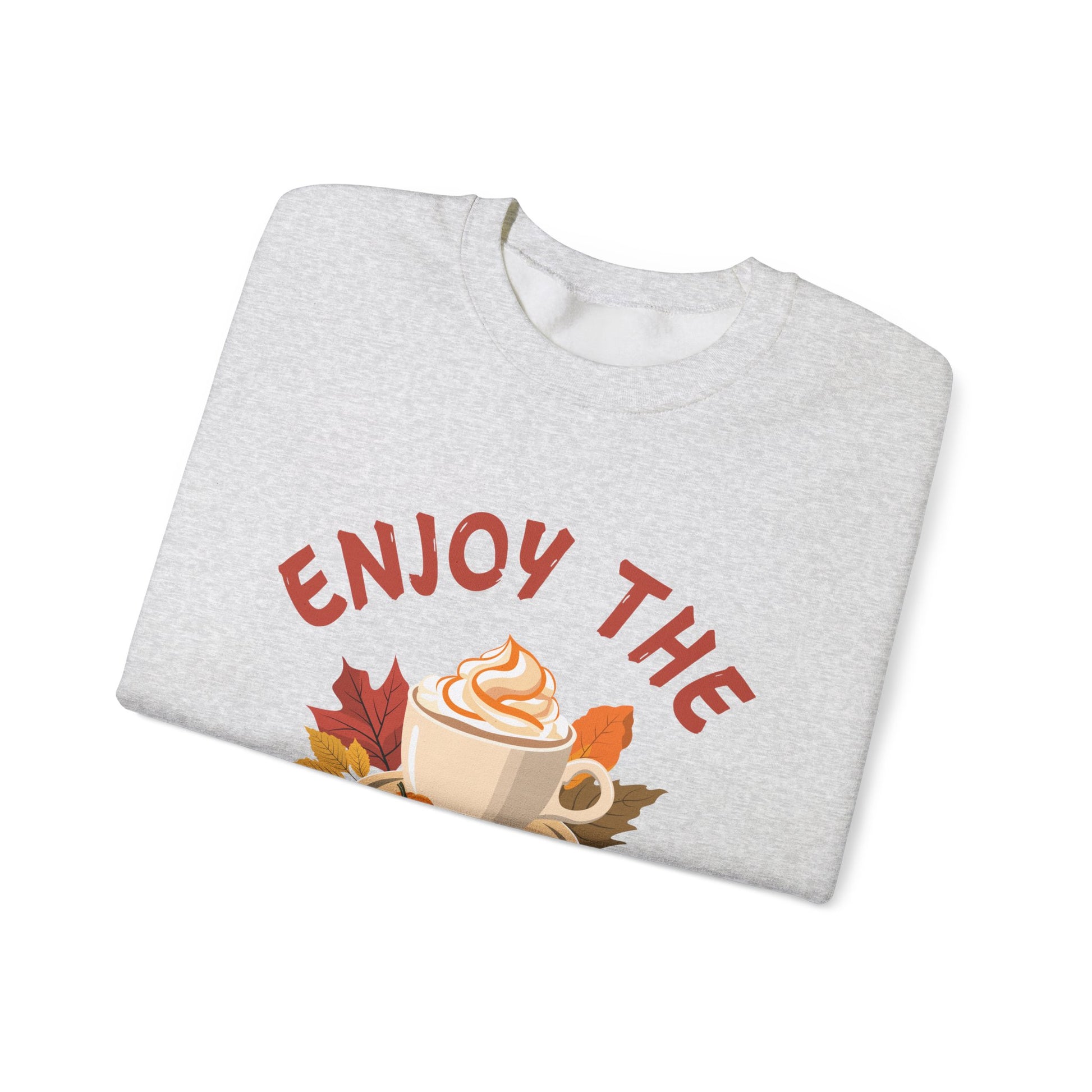 Folded gray sweatshirt with 'Enjoy the' text and coffee cup graphic on a white background