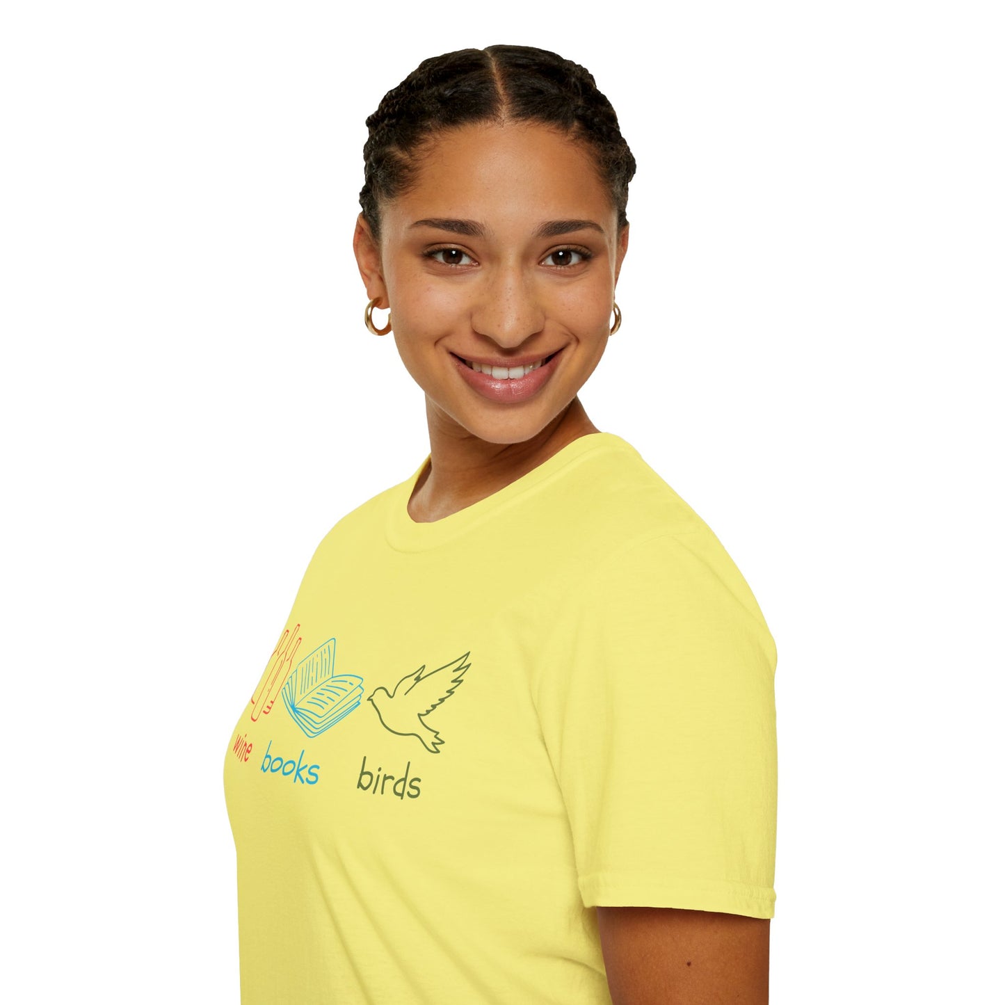 Girl wearing yellow t-shirt with colorful graphics and text "wine books birds"on a white background