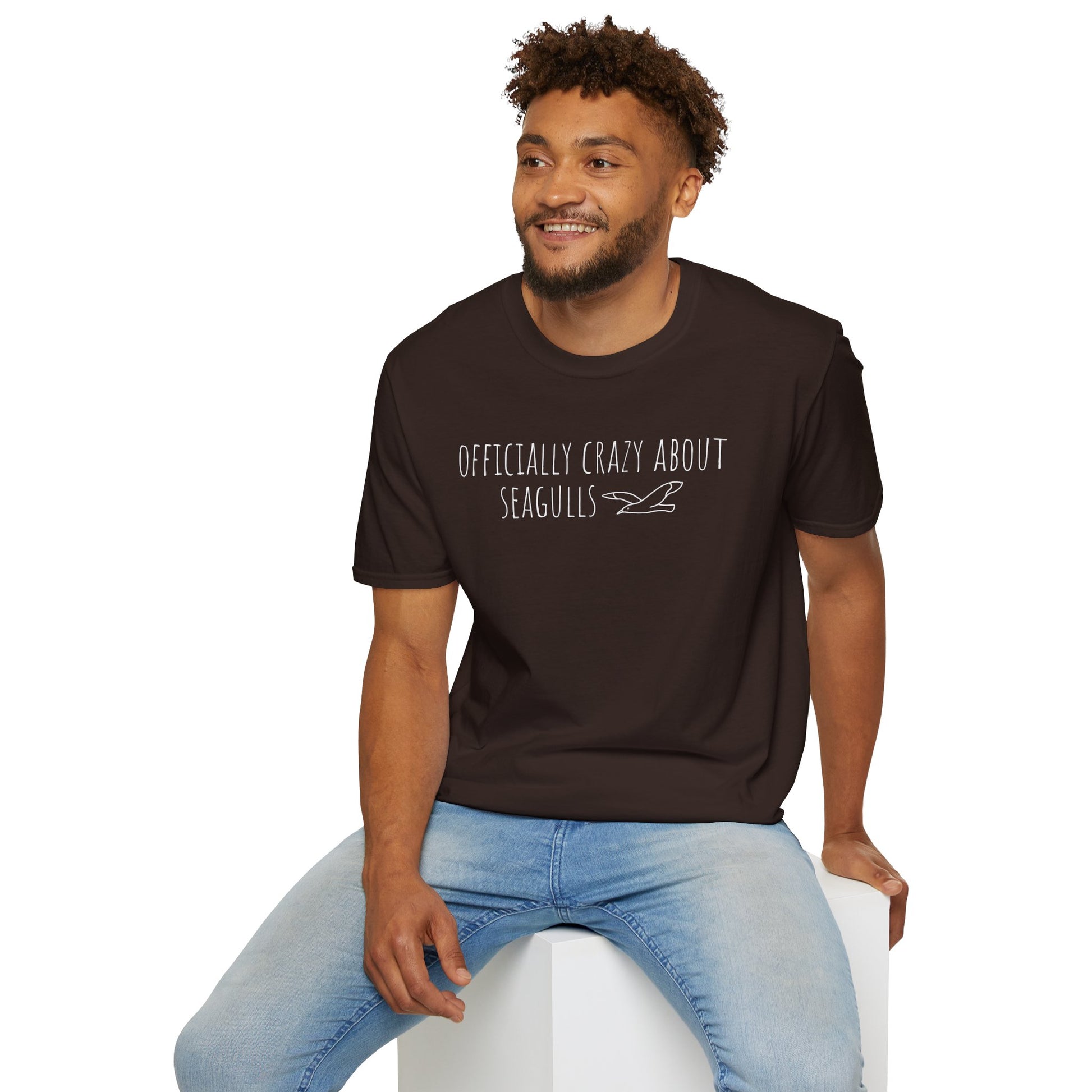 Men wearing brown t-shirt with text 'Officially crazy about seagulls' on a white background